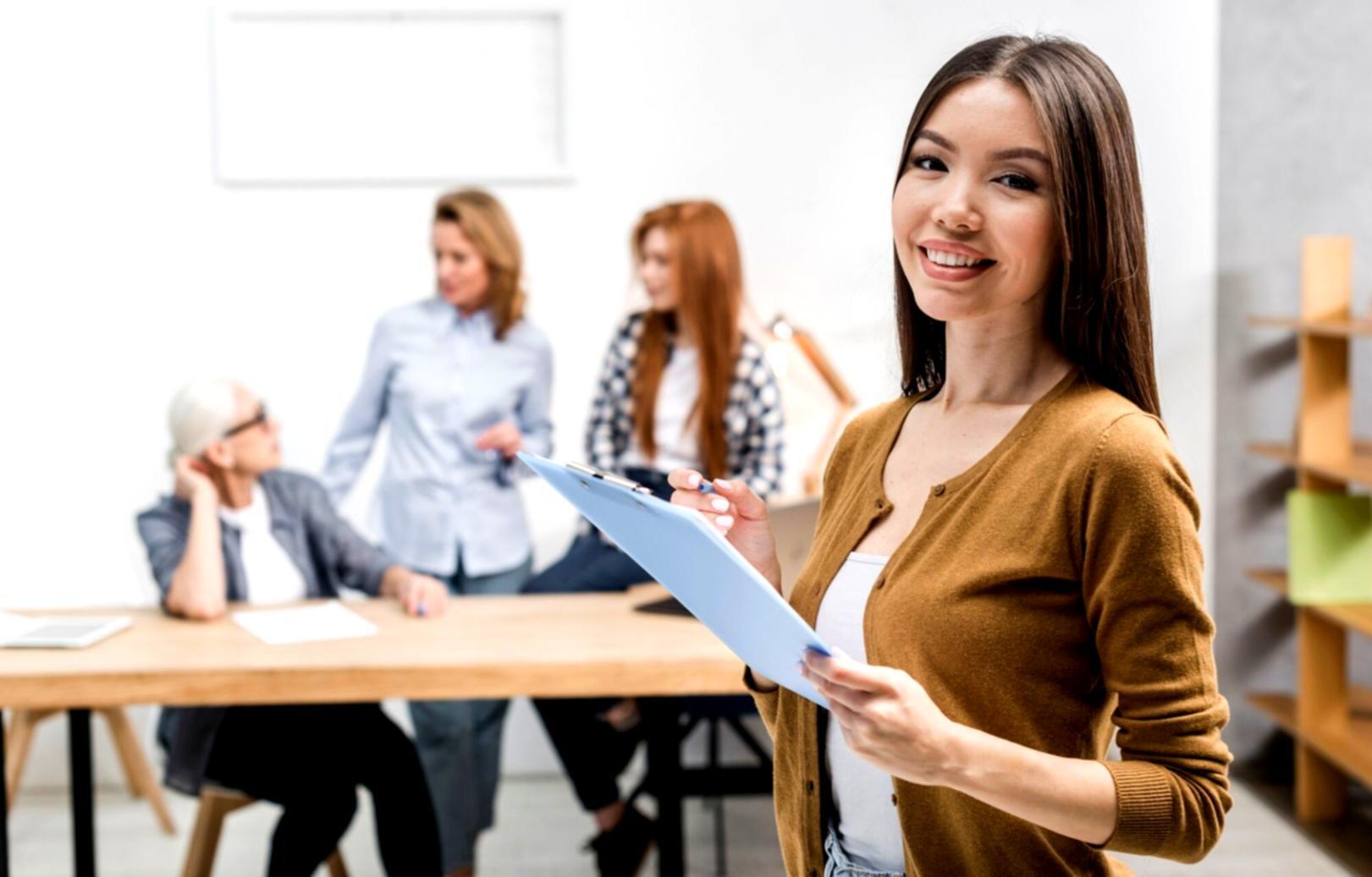 Instructor presenting financial concepts on a whiteboard to engaged participants